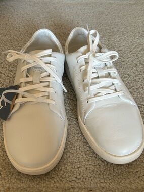 OluKai women’s All-White Leather Lace-Up Sneakers